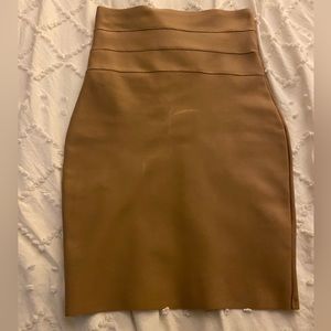 Taupe/Beige skirt . Slight defect noted in front but barely visible .